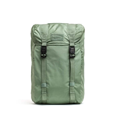 The M23 - Ripstop ROBIC® by GORUCK, in Seaspray and Speed Tan, showcases a top flap design with two black buckles on the front and a stitched rectangular patch. Crafted from durable materials, this field pack stands upright against a plain white background.