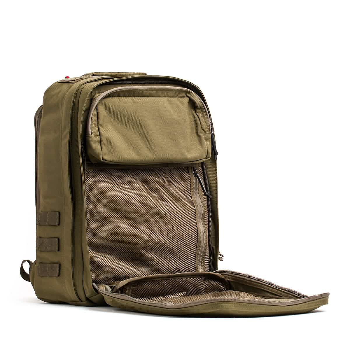 The GR2 - Cordura from GORUCK is open, displaying its roomy interior with several compartments. The front pocket is unzipped, revealing mesh organization sections inspired by Special Forces ruck packs. It also includes a durable side handle and a straightforward, functional design.
