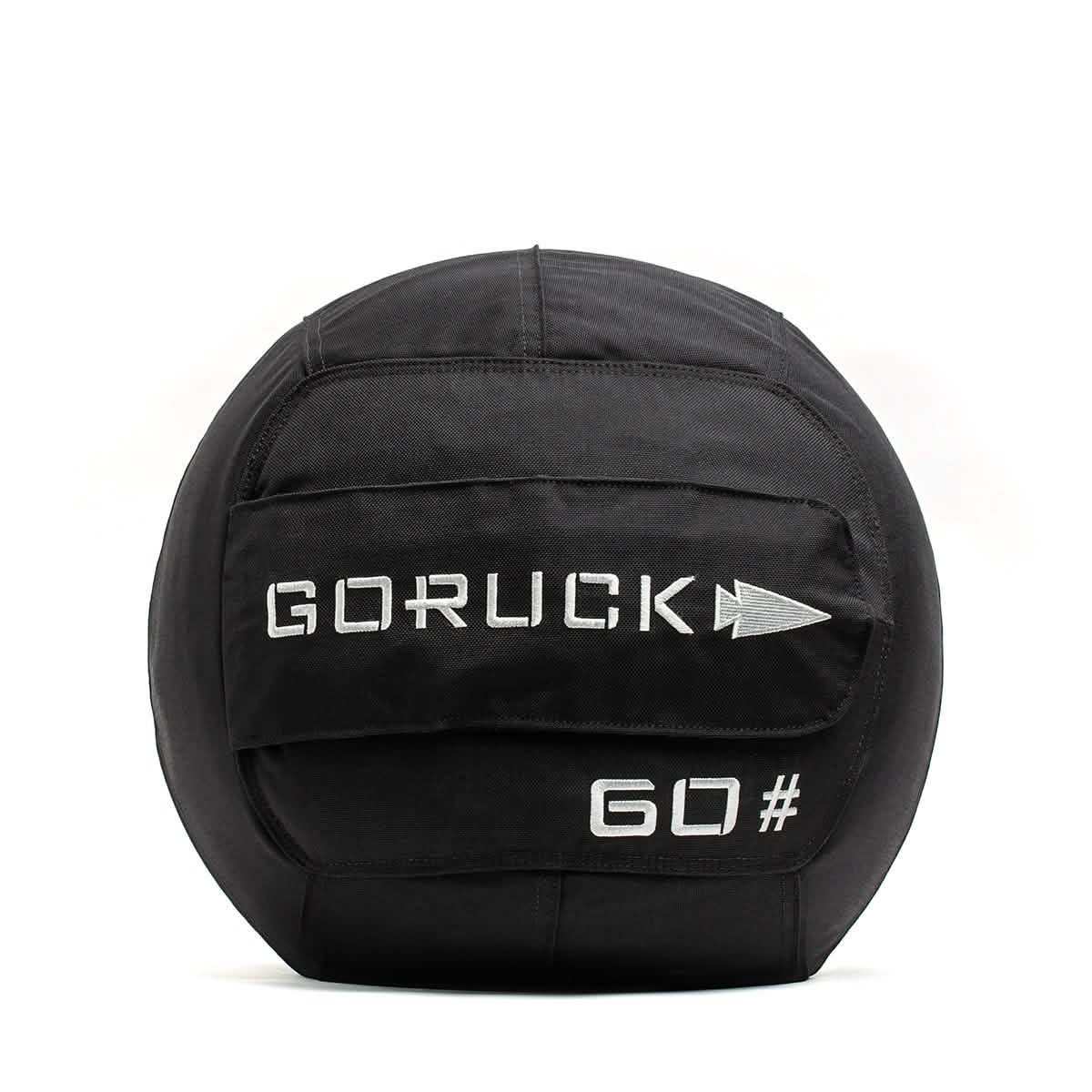 The GORUCK Sand Medicine Ball in black, featuring "GORUCK" and "60#" in white, includes a reinforced handle for lifting. Ideal for fitness and weight training, it's perfect for enhancing core stability in your home gym.