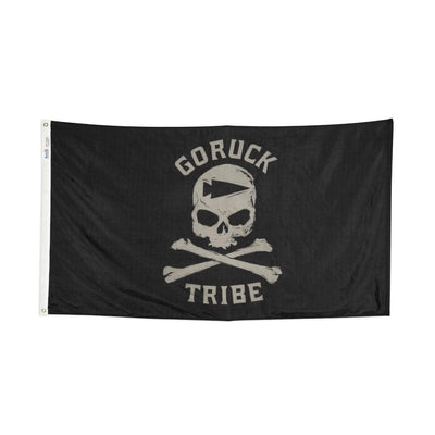 The Flag - Tribe, crafted by Annin Flagmakers, is a black flag with a skull and crossbones design and "GORUCK TRIBE" text on a crisp white background.