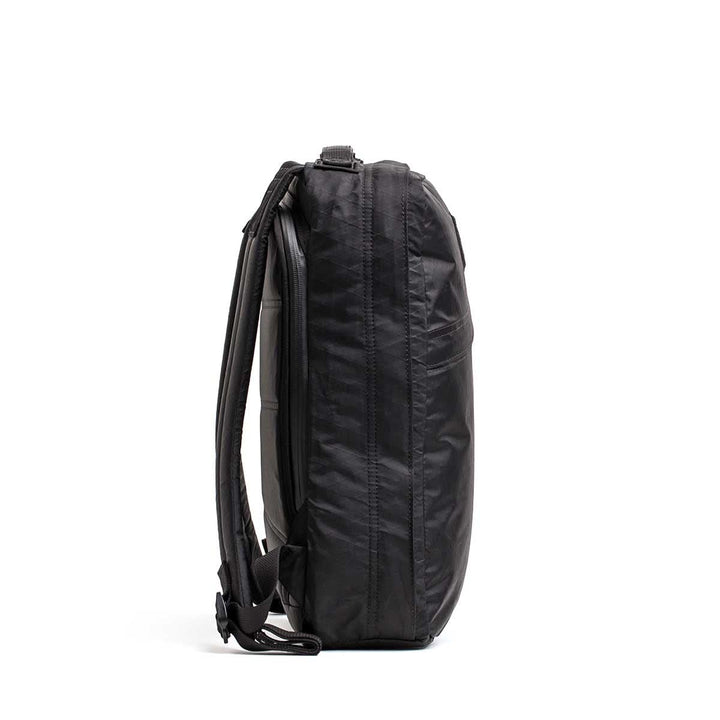 The GR0 - X-PAC waterproof black backpack is displayed upright from the side on a white background.