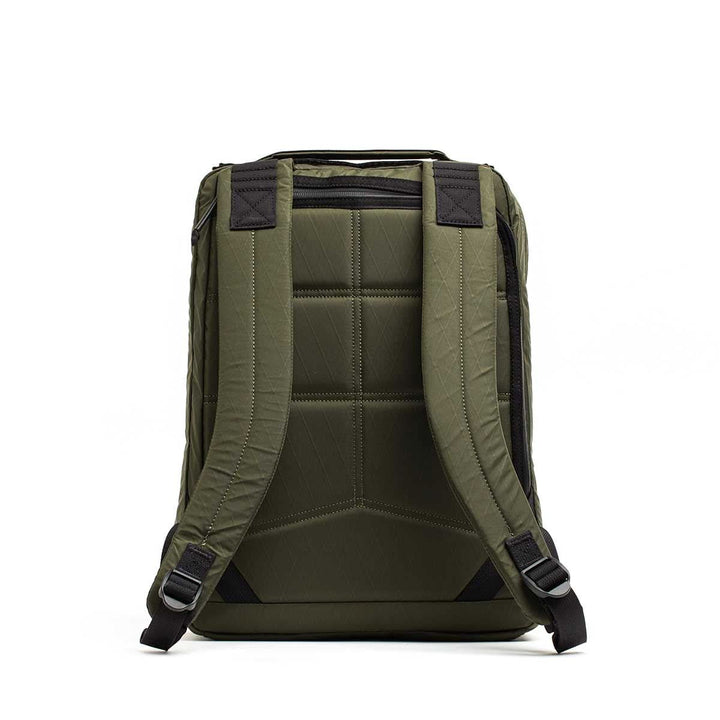 The GR0 - X-PAC backpack in olive green features black straps and a padded back, shown from the rear on a white background. Made with lightweight, waterproof X-PAC material for dependable everyday use.