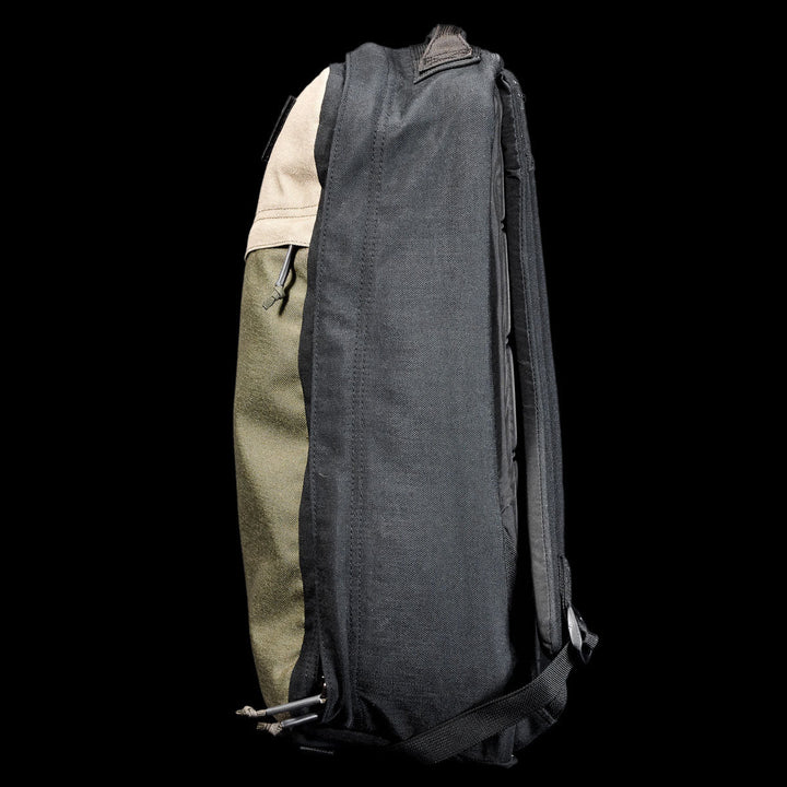 Side view of the GR1 Shooter 26L - Built by SCARS, showing black, green, and tan CORDURA® panels against a black background—engineered for durability by the SCARS team.