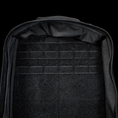 The spacious interior of the black GR1 Shooter 26L - Built by SCARS, made from rugged CORDURA®, has horizontal loop fastener strips—perfect for SCARS team needs or organized adventures.