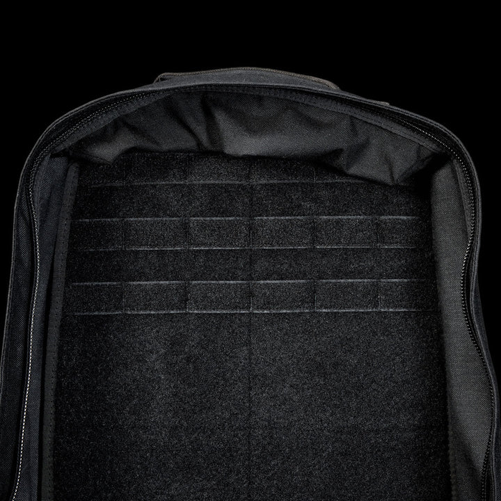 The spacious interior of the black GR1 Shooter 26L - Built by SCARS, made from rugged CORDURA®, has horizontal loop fastener strips—perfect for SCARS team needs or organized adventures.