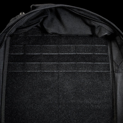 Close-up of the GR1 Shooter 26L - Built by Scars backpack interior, made with Special Forces Grade CORDURA®, showcasing multiple horizontal Velcro straps and a zippered edge.