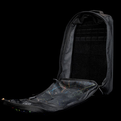 A black GR1 Shooter 26L - Built by Scars backpack, unzipped and open, made from Special Forces Grade CORDURA®, shows a mesh pocket inside the front flap.