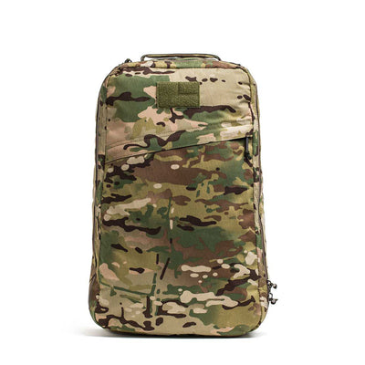 The GR1 USA - X-PAC rucksack, with a camouflage pattern and multiple zippers, is displayed against a white background.