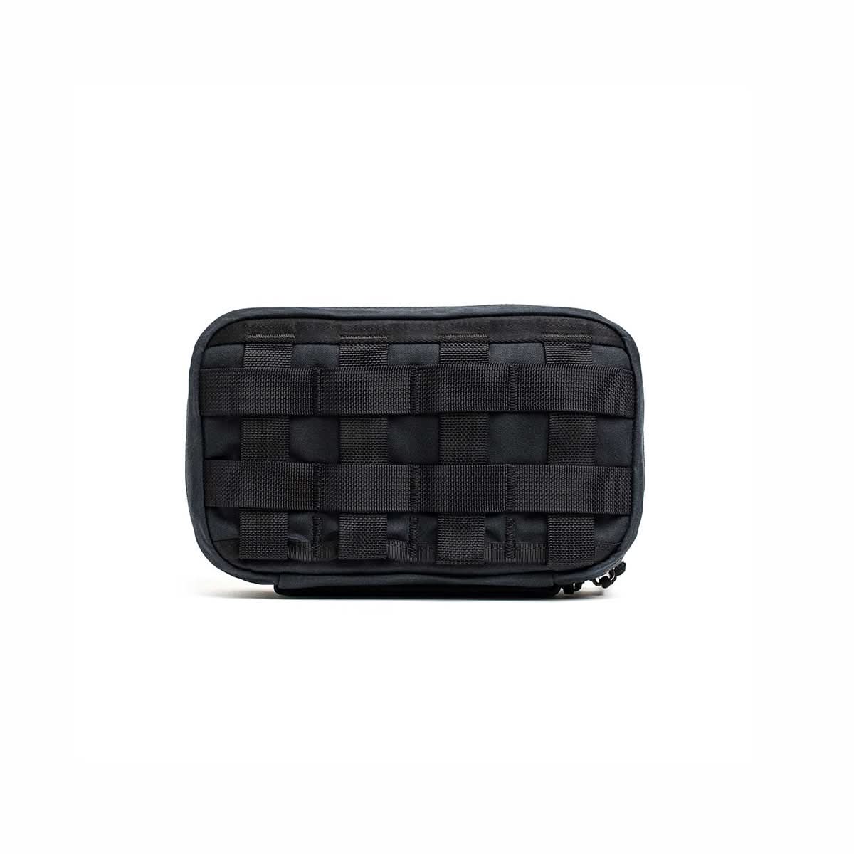 The GR1 Field Pocket - Waxed Canvas, a black tactical pouch with front MOLLE webbing, is displayed against a plain white background.