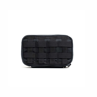 The GR1 Field Pocket - Waxed Canvas, a black tactical pouch with front MOLLE webbing, is displayed against a plain white background.