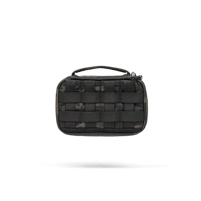 The GR1 Field Pocket is a compact black tactical pouch with a handle and webbing, ideal for organizing electronics or carrying camera gear. Shown isolated on a white background.