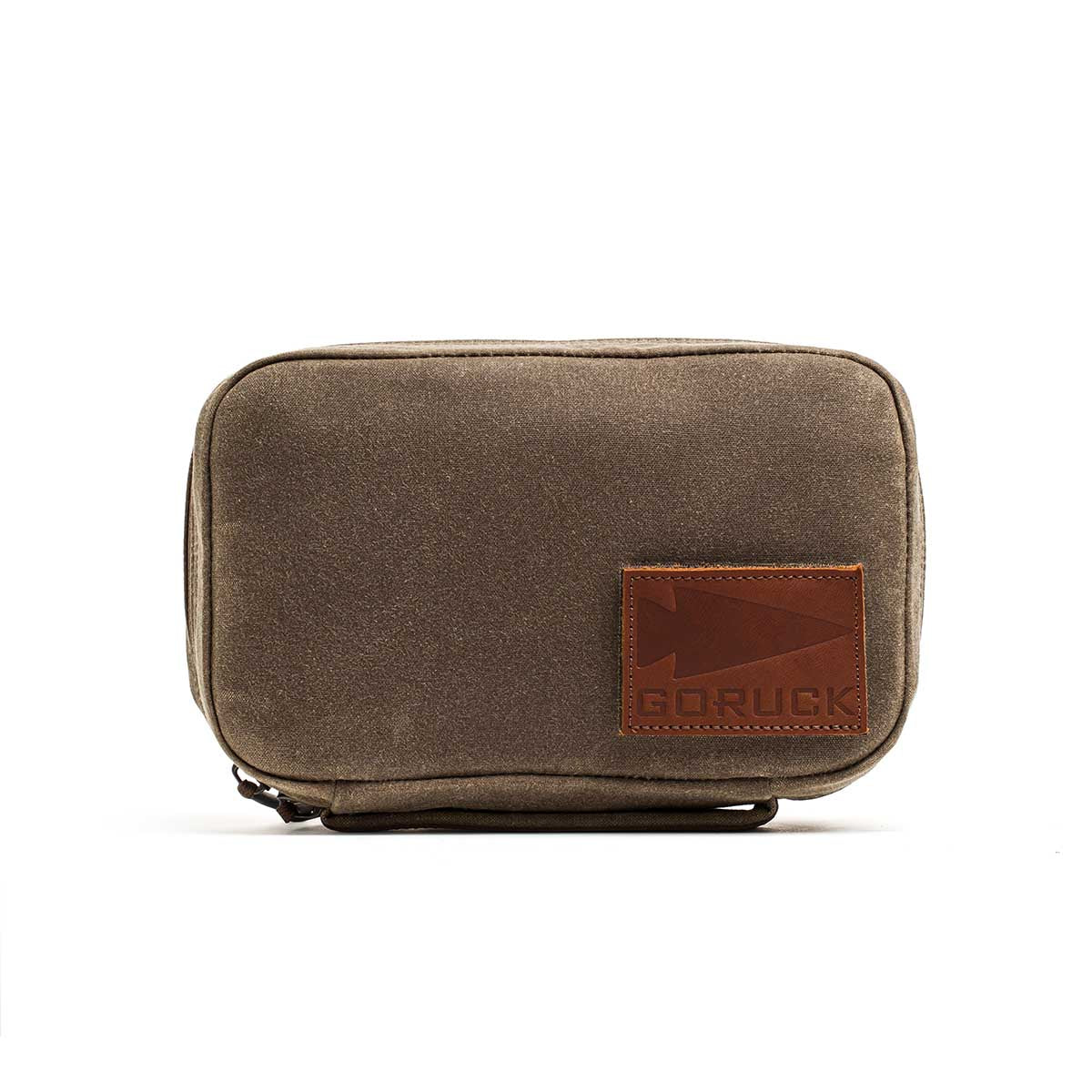 The GR1 Field Pocket - Waxed Canvas is a small brown pouch with a leather GORUCK logo patch on the front, shown against a white background.