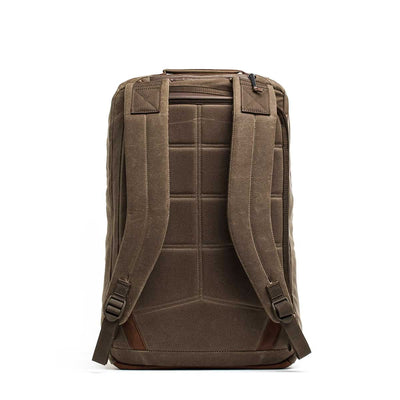 The GR2 - Heritage Waxed Canvas Backpack is shown from the back, featuring padded straps, a top zippered pocket, and is crafted from durable waxed duck canvas.