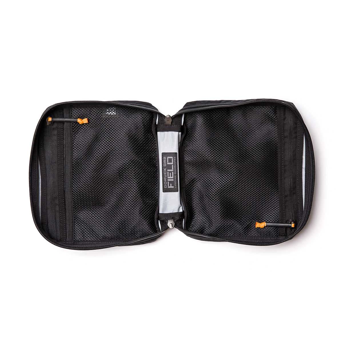 Open GR2 Field Pocket - X-PAC electronics organizer with mesh pockets and vibrant orange AquaGuard zippers, displayed from above on a white background.