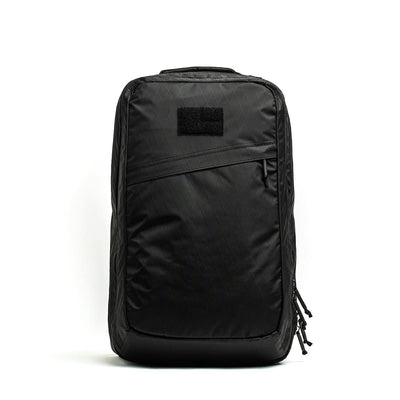 The GR2 X-PAC is a black, rectangular backpack featuring a diagonal AquaGuard zipper pocket, displayed against a plain white background.