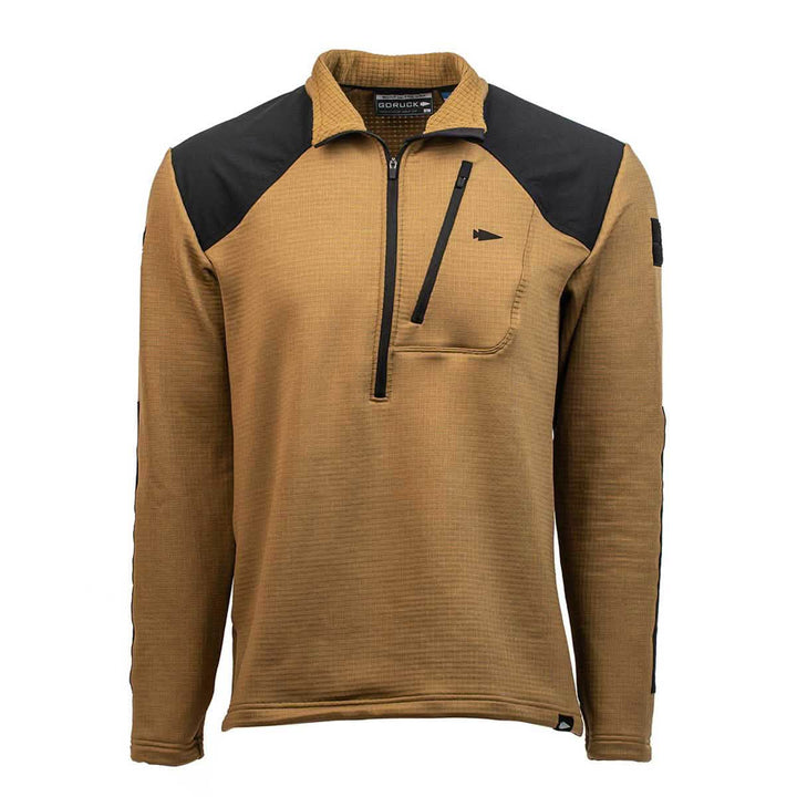Introducing the Men’s Half Zip - Polartec Grid Fleece by GORUCK: This brown long-sleeve pullover is expertly crafted with ToughDry Fabric and features eye-catching black shoulder panels. It includes a convenient zippered half-neck, a zippered chest pocket on the left side, and a small patch detail near the right shoulder for added rugged appeal.