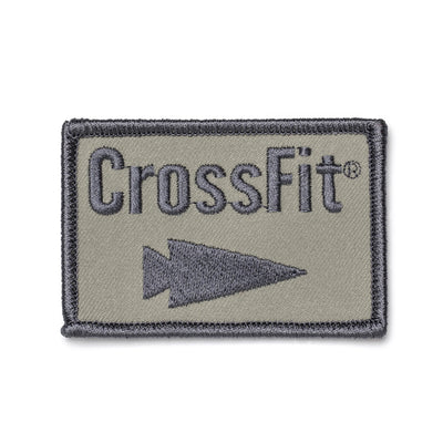 The GORUCK-DEMO Patch - GORUCK x CrossFit is a rectangular embroidered patch featuring a gray border and background, with the word "CrossFit" in dark gray above an arrow pointing to the right.