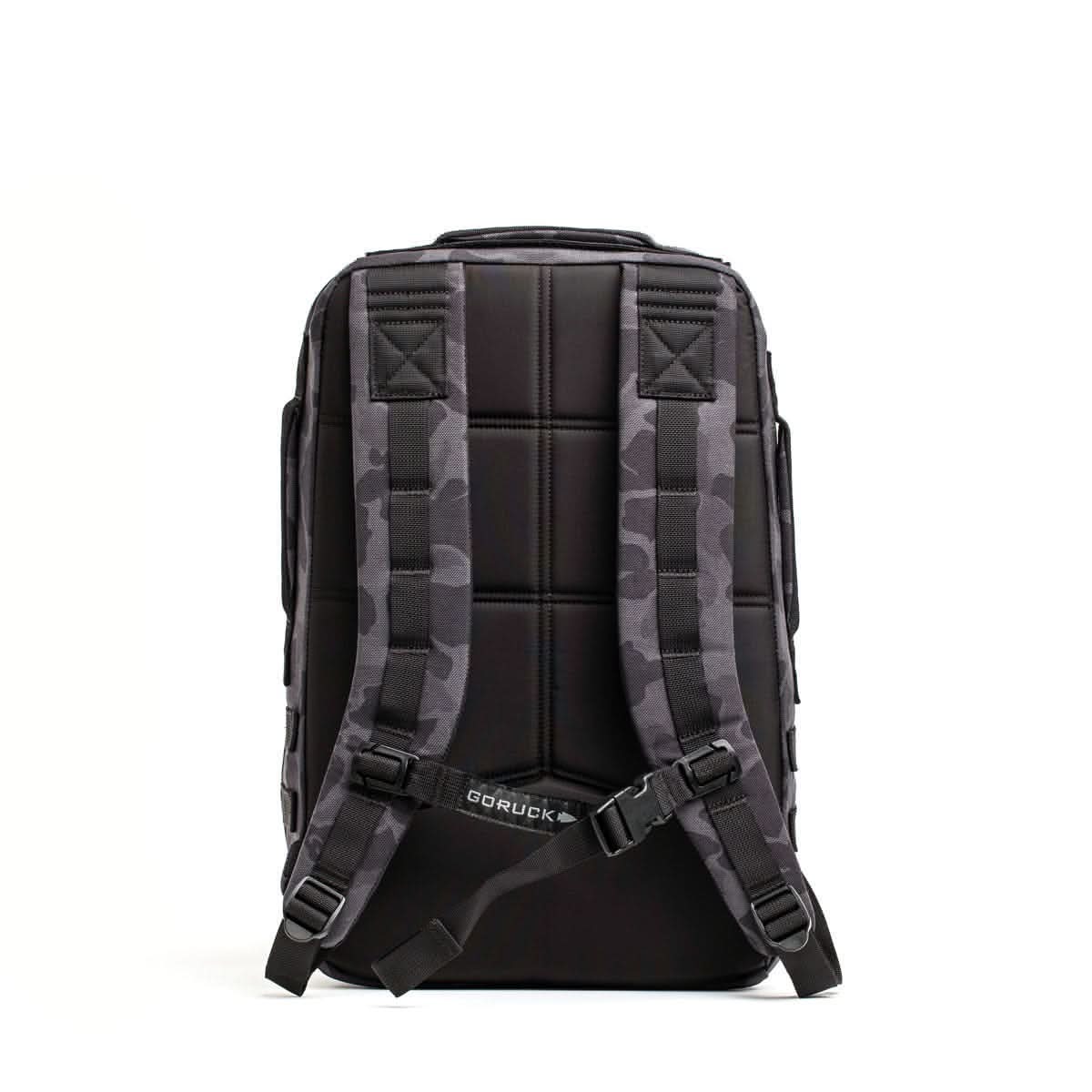 The Rucker 4.0 backpack, shown from the back with camouflage-patterned straps against a white background, is a durable rucksack designed for rucking adventures.