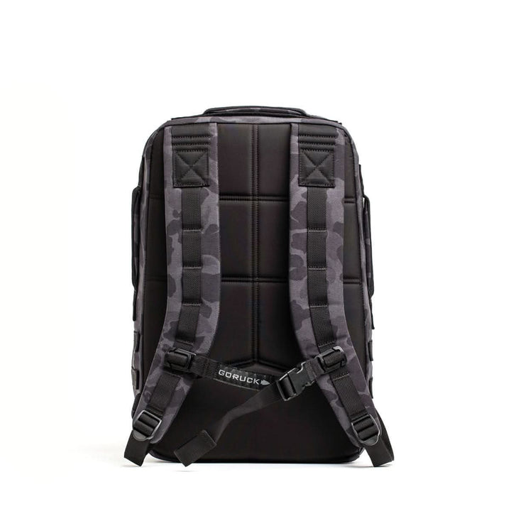 The Rucker 4.0 backpack, shown from the back with camouflage-patterned straps against a white background, is a durable rucksack designed for rucking adventures.