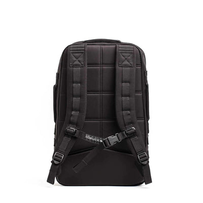 The GORUCK Rucker 4.0 backpack, in black, features ergonomic and padded shoulder straps along with a chest buckle. Its quilted back panel offers cushioned comfort for rucking adventures, while its durable and sleek design makes it ideal for everyday use or travel.