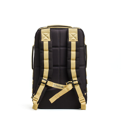 A Rucker 4.0 by GORUCK in black, featuring beige straps and a Rucker® logo on the back panel, set against a white background.
