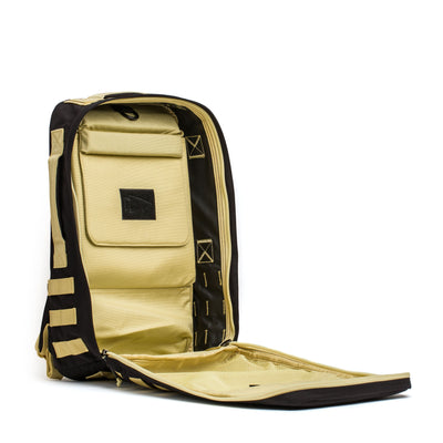 Open beige GORUCK Rucker 4.0 backpack with multiple compartments and zippers on a white background, perfect for rucking adventures.