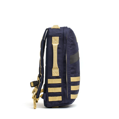 Side view of a navy blue Rucker 4.0 backpack by GORUCK, featuring beige straps and accents, ideal for rucking enthusiasts.