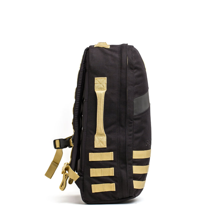 Side view of a black Rucker 4.0 backpack by GORUCK featuring beige straps and a side zipper pocket, ideal for rucking adventures, set against a plain white background.
