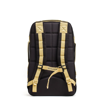 The GORUCK Rucker 4.0 is a black and tan backpack with padded straps, ideal for rucking, and features the brand's logo prominently on the back.