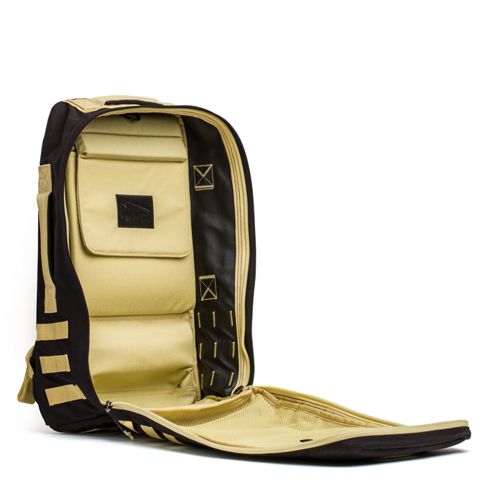 Display the interior compartments and pockets of the black and beige GORUCK Rucker 4.0 backpack, perfect for organizing Ruck Plates on your rucking adventures.