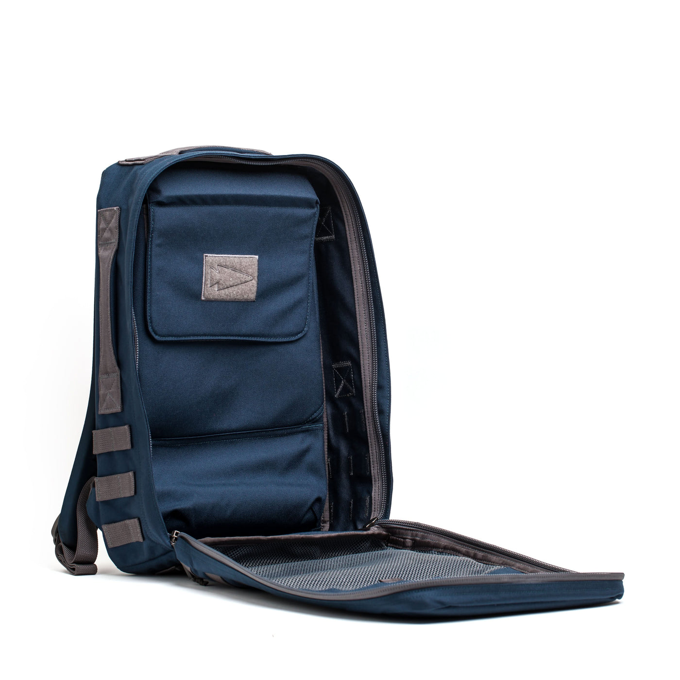 The Rucker 4.0 is a blue rucksack with its main compartment open, revealing interior pockets, mesh lining, and space for ruck plates—ideal for rucking adventures.