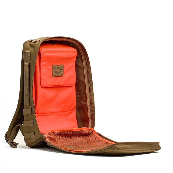 The Rucker 4.0 backpack in brown features a front unzipped to show its vibrant orange interior and multiple compartments—ideal for your rucking adventures.