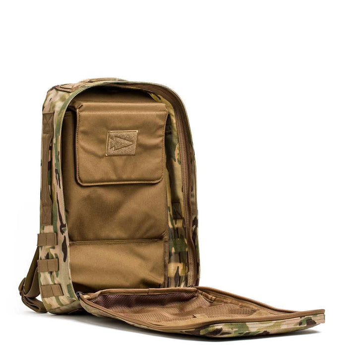 The Rucker 4.0 backpack in camouflage features an open main compartment, interior pockets, brown fabric lining, and integrated space for a Ruck Plate®—purpose-built for rucking.