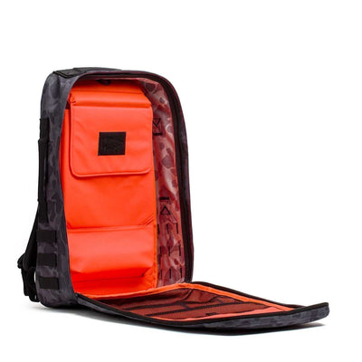 The Rucker 4.0 backpack in black camo features a bright orange interior and organized compartments when fully unzipped—ideal for rucking or everyday use.