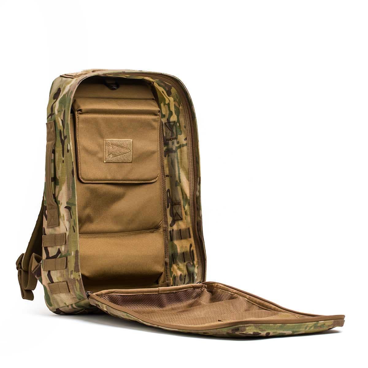 The Rucker 4.0 rucksack, shown unzipped with a tan interior, features compartments and a mesh pocket—ideal for organizing gear or carrying Ruck Plates on your next rucking adventure.