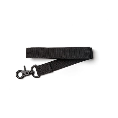 A Small Dog Leash from GORUCK, crafted from durable, military-grade nylon in a sleek black color, featuring a secure swivel hook clip on one end, is laid flat on a white background.