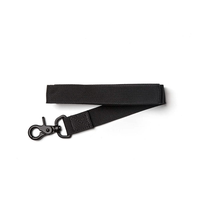 A Small Dog Leash from GORUCK, crafted from durable, military-grade nylon in a sleek black color, featuring a secure swivel hook clip on one end, is laid flat on a white background.