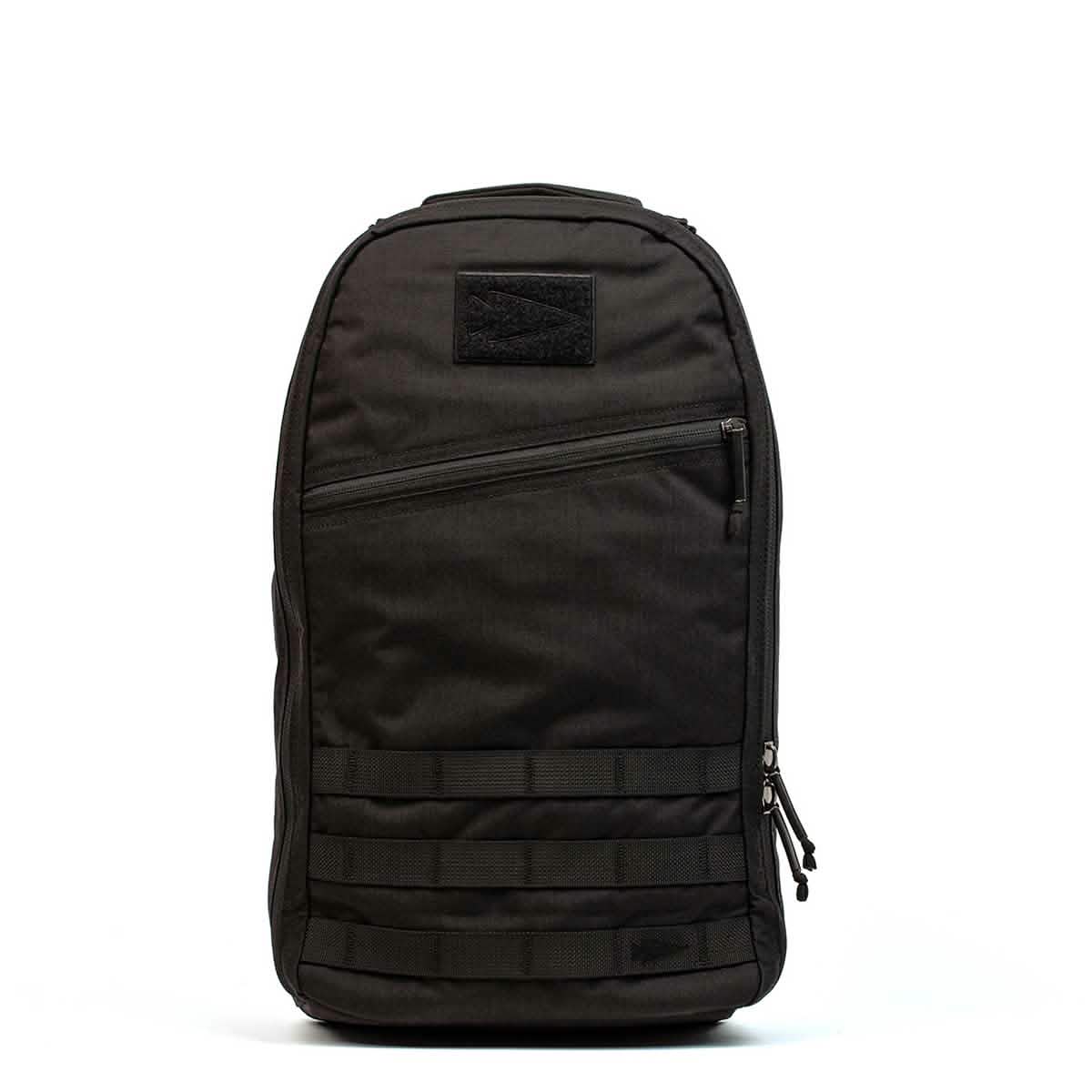 The Bullet Ruck Laptop - 16L by GORUCK is a sleek black backpack that seamlessly combines style with functionality. It includes a zippered front pocket, two side zippers, and a top handle. Designed for everyday use, this durable backpack offers subtle lumbar support and comes equipped with a laptop compartment.