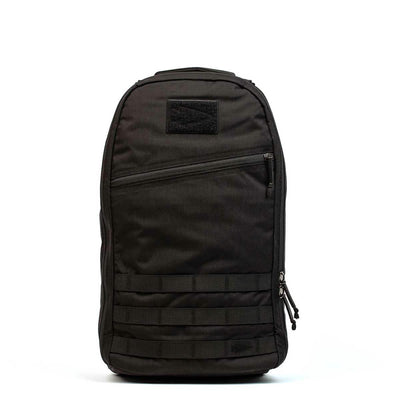 The Bullet Ruck Laptop - 16L by GORUCK is a sleek black backpack that seamlessly combines style with functionality. It includes a zippered front pocket, two side zippers, and a top handle. Designed for everyday use, this durable backpack offers subtle lumbar support and comes equipped with a laptop compartment.