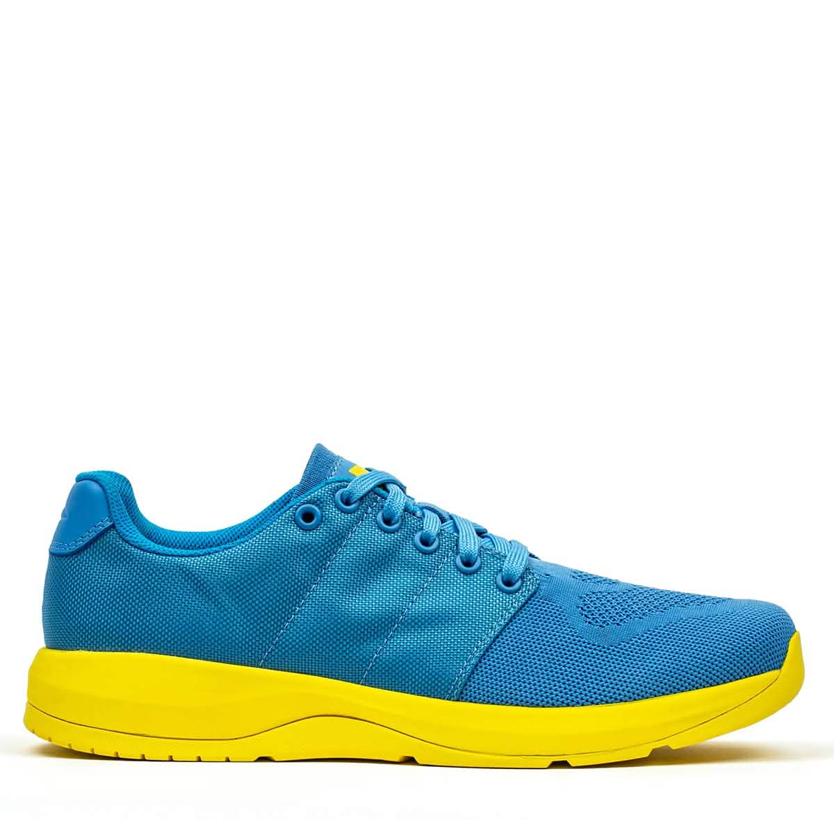 The Ballistic Trainers - Blue + Yellow features a blue upper made from durable CORDURA® Ballistic Nylon and a bright yellow sole, shown from the side on a white background—ideal for functional fitness.