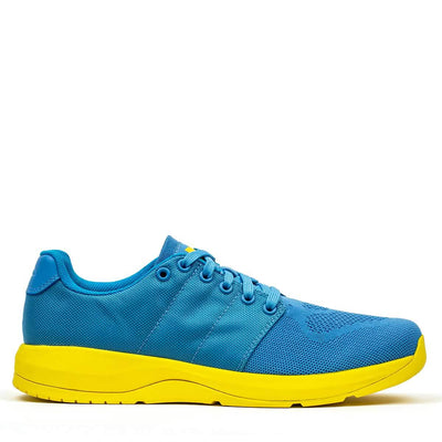 The Ballistic Trainers - Blue + Yellow features a blue upper made from durable CORDURA® Ballistic Nylon and a bright yellow sole, shown from the side on a white background—ideal for functional fitness.