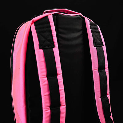 Close-up of the back and straps of the Bullet Ruck - Classic - Hot Pink daypack made from Cordura, set against a black background.