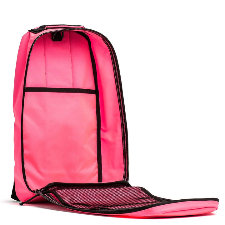 The Bullet Ruck - Classic - Hot Pink features a bright pink design with black trim, an unzipped main compartment showing inner pockets—ideal for everyday use or light rucking.