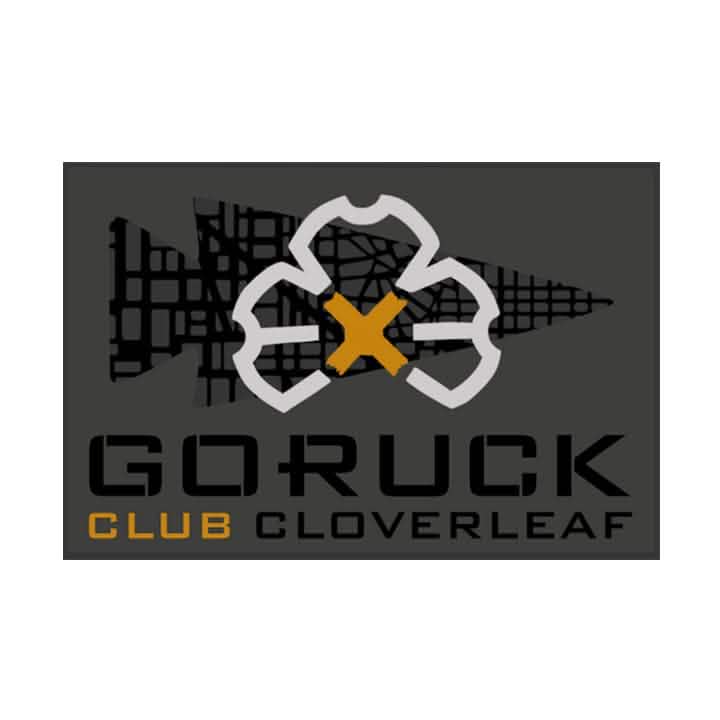 Patch for the GORUCK Ruck Club Cloverleaf showcasing a stylized cloverleaf design intersected by a yellow X on a dark background. The bold lettering spells out "GORUCK Ruck Club Cloverleaf," embodying the spirit of community fitness and ruck club camaraderie.