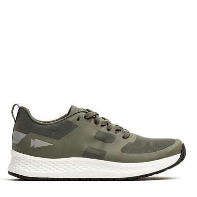 Introducing the Men's Rough Runner - Earth athletic shoe by GORUCK: a sleek green design featuring a white textured sole and black accents. This lace-up style includes reflective arrow details and is crafted with lightweight, breathable mesh fabric. The Gradient Density midsole ensures a comfortable fit for any adventure.