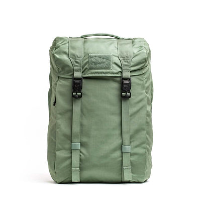 The GORUCK M23 - Ripstop ROBIC® in Seaspray and Speed Tan is a textured rucksack featuring a top flap with two black buckles, a carrying handle, and adjustable straps. Made from durable materials, it seems lightweight and functional for everyday use or travel.