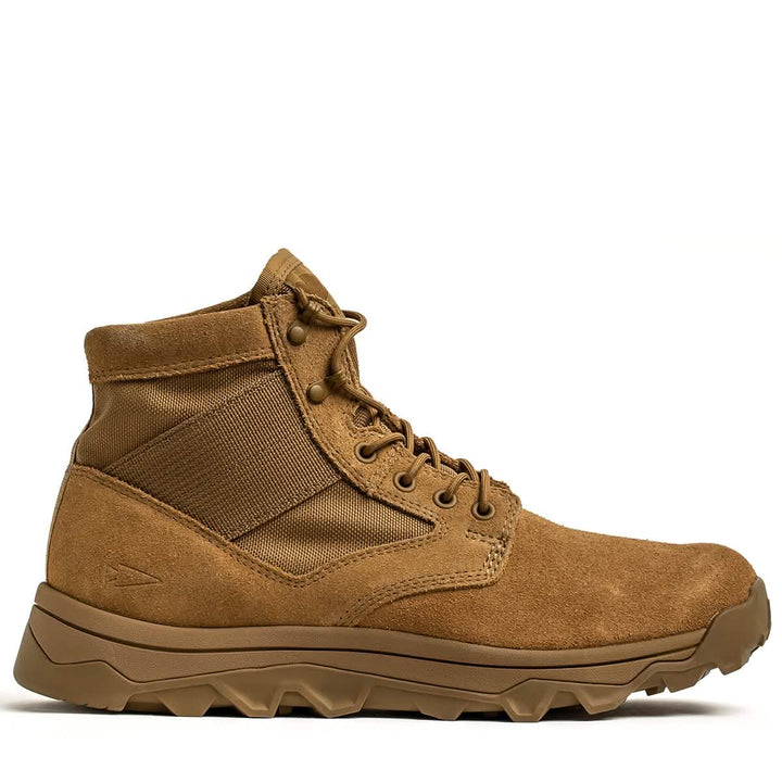 The MACV-2 - Mid Top - Coyote by GORUCK is a tan tactical boot featuring a high ankle design with a robust triple compound outsole and lace-up closure. Crafted from canvas and suede, it includes reinforced stitching, making it ideal for outdoor adventures.