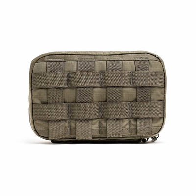 Introducing the GR1 Field Pocket - Ripstop ROBIC® by GORUCK, a durable rectangular-shaped tactical pouch designed to withstand tough conditions. Made from ripstop nylon, it features reinforced grid-like stitching and water-resistant webbing on the front, allowing for easy attachment of additional gear. This versatile pouch is ideal as an electronics organizer and is perfect for outdoor activities or military use.