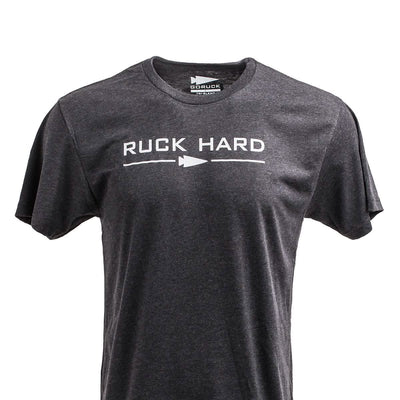 The Ruck Hard Tee - Tri-Blend is a gray T-shirt with "RUCK HARD" and an arrow design on the front, ideal for fitness or ruck training.