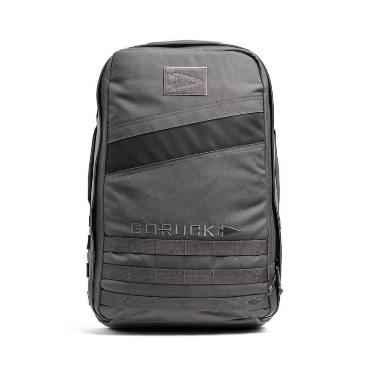The Rucker 4.0 in gray with a black diagonal stripe is perfect for fitness enthusiasts, featuring multiple pockets and "GORUCK" on the front, making it ideal for rucking adventures.